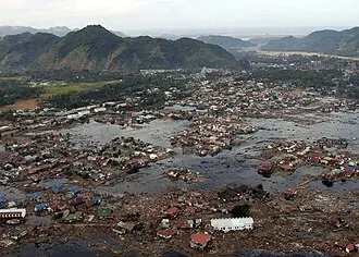 Indian Ocean (Jan. 2, 2005) – A village near the coast of Sumatra lies in ruins after the Tsunami that struck South East Asia. Helicopters assigned to Carrier Air Wing Two (CVW-2) and Sailors from USS Abraham Lincoln (CVN 72) are conducting humanitarian operations in the wake of the Tsunami that str